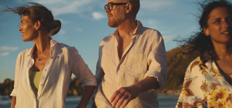 Three adults walking outdoors at sunset, smiling and enjoying each other's company, featured in an article about understanding urinary incontinence in adults.