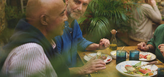 Men talk and enjoy a meal