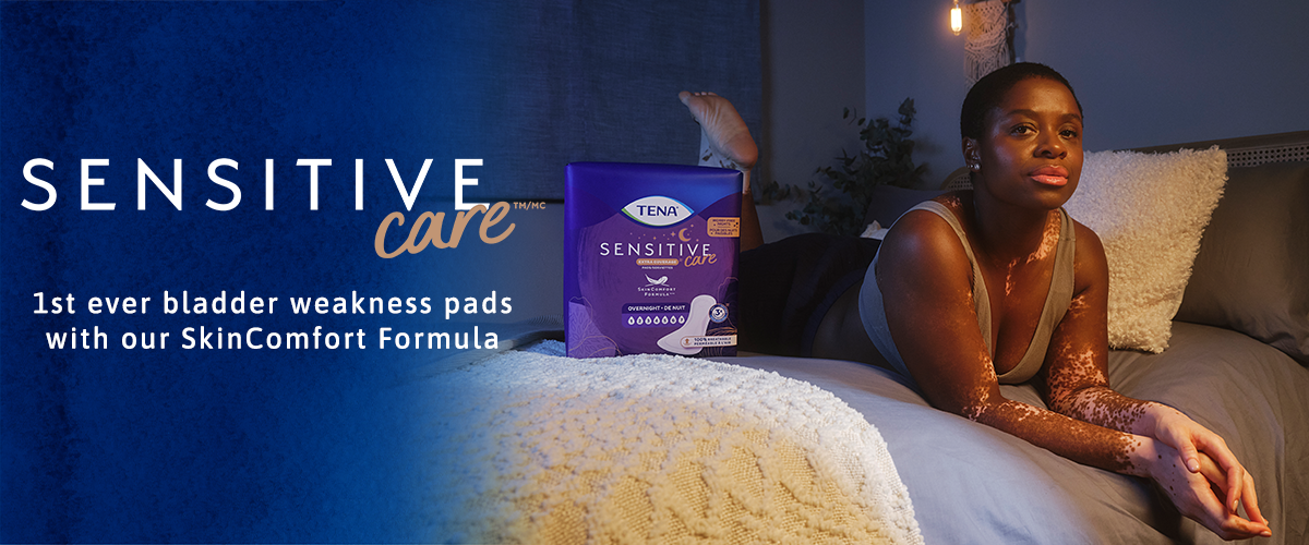 A woman lying on the bed next to a package of TENA pads with the text Sensitive Care 1st ever bladder weakness pads with our SkinComfort Formula